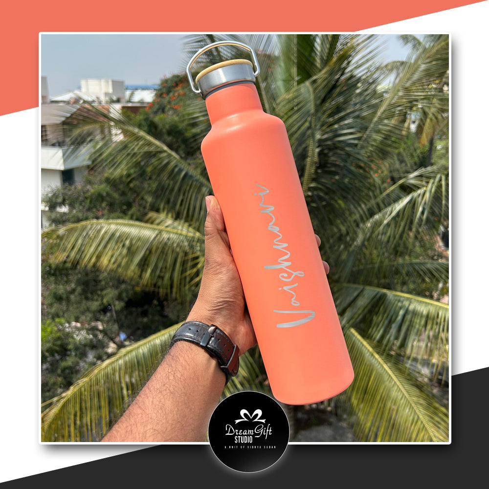 personalized bottle with name printed in silver color on a orange bottle