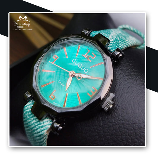 GUGUO Watch Featuring a Bold Turquoise Dial, Sleek Rose-Gold Markers, and a Textured Teal Fabric Strap