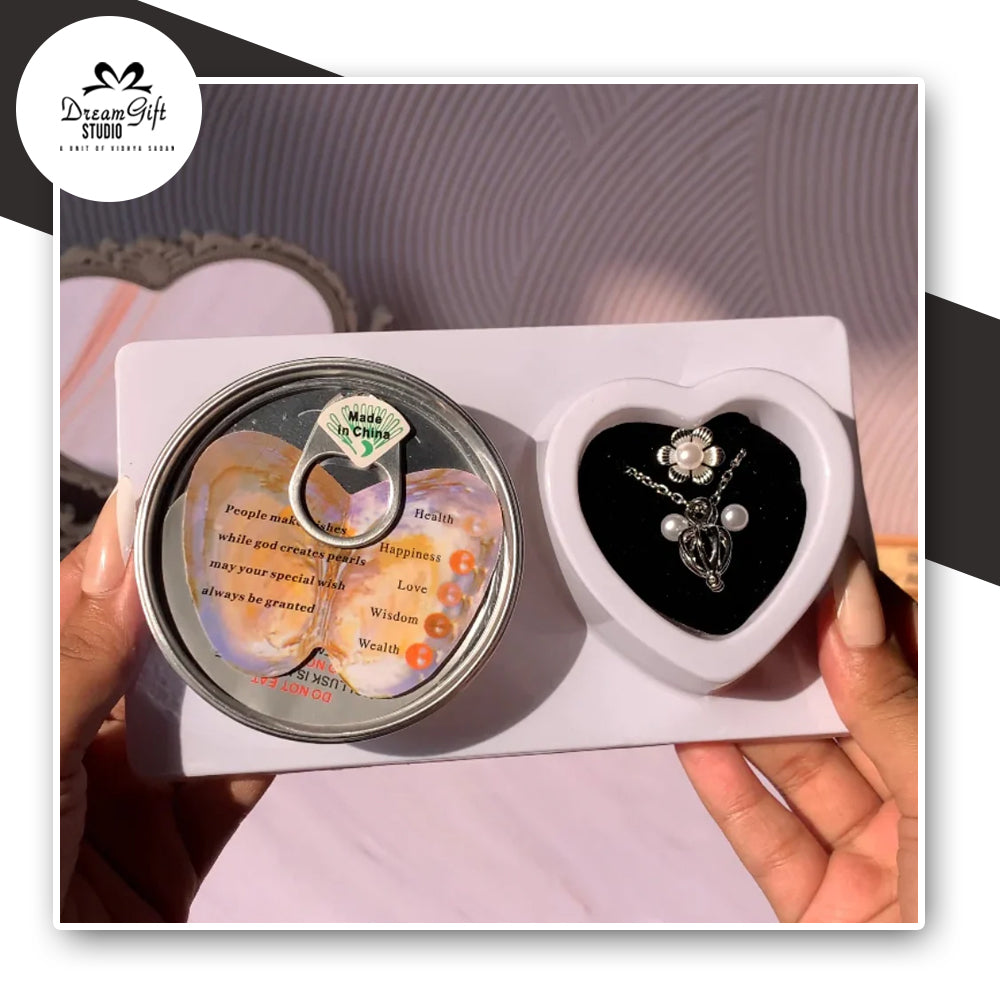 love pearl necklace set with a can containing oyster , a necklace to insert the pearl , a ring and two earrings